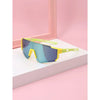 Yellow-framed kids UV protection sports sunglasses resting on a white surface against a pink background.