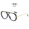 Black vintage oversized designer sunglasses with gold accents