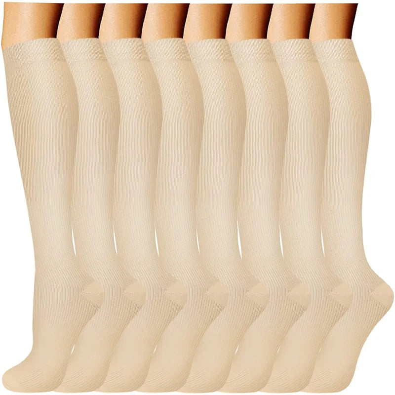 A row of beige compression socks for vein support, displayed vertically.