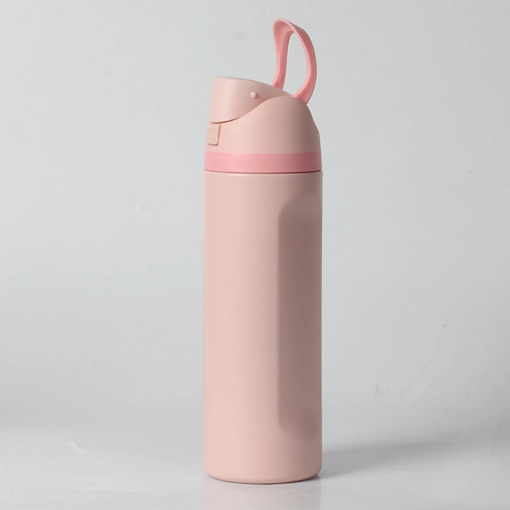 A pink insulated stainless steel water bottle with a dual drinking spout is shown standing upright.