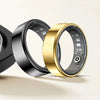 A close-up view of a black and gold smart health ring fitness tracker, showing the inner sensor mechanism.