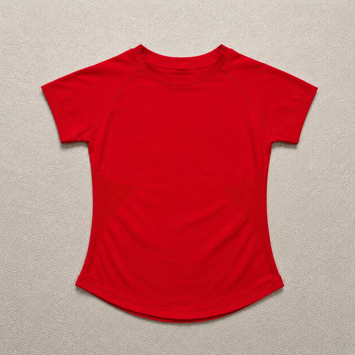A bright red seamless high-waist yoga top for women.