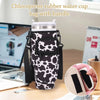 A black and white chloroprene rubber water cup bag with a handle is shown on a desk next to a laptop.