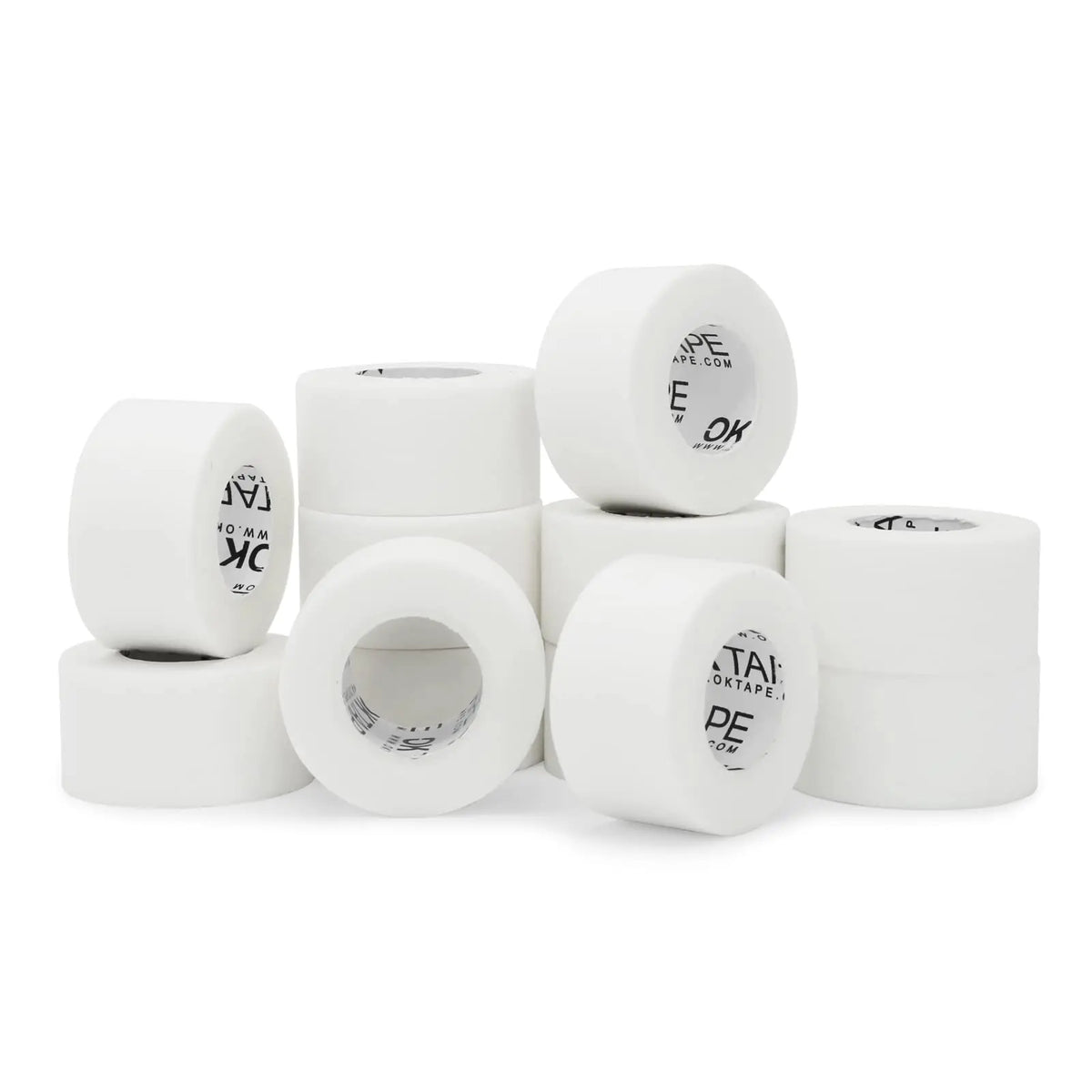 A collection of white latex-free nonwoven breathable medical tape rolls with various markings.
