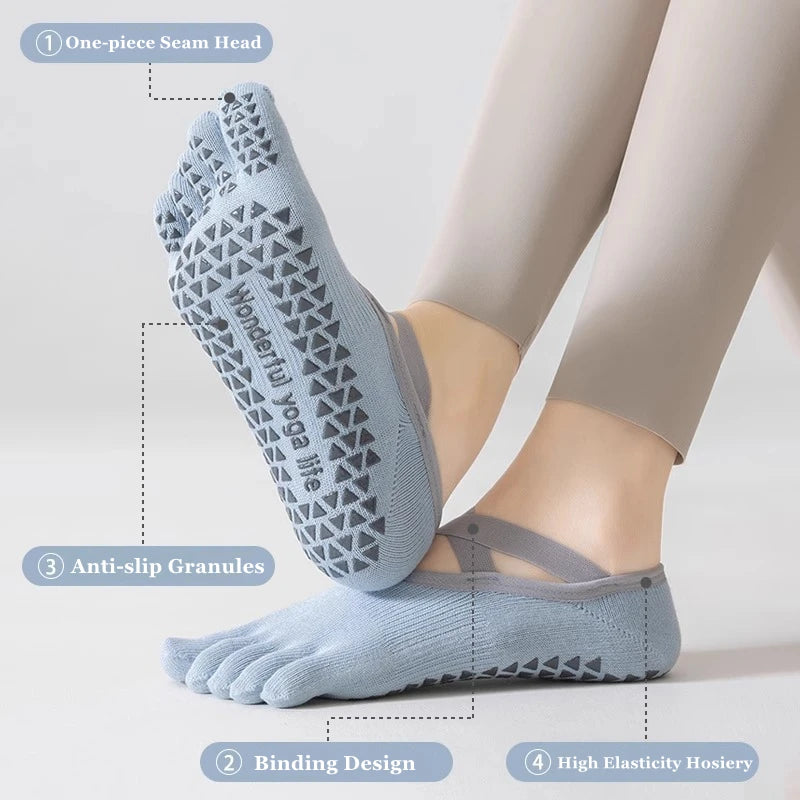 A pair of light blue five-finger yoga socks shown on a foot, highlighting the bonding design and anti-slip granules.