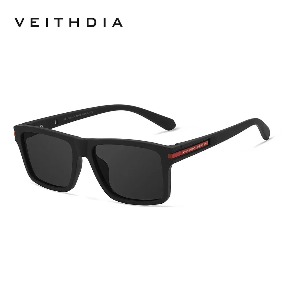 A pair of black square polarized sunglasses with a dark lens and a red accent on the frame.
