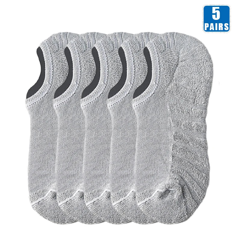 Five pairs of light gray men's cotton crew socks displayed together.