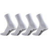 A set of white athletic grip socks shown from the side, featuring a textured pattern on the sole.
