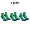 Six pairs of green compression socks displayed side by side.