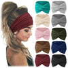 Colección de bandas para el pelo de tela en varios colores, incluyendo verde azulado, beige, gris, rosa y verde oscuro, mostr