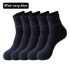 A pack of five navy blue bamboo fiber socks displayed together.