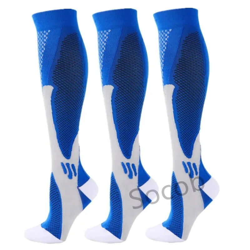 A set of three blue compression socks for athletes and medical use shown from the side.