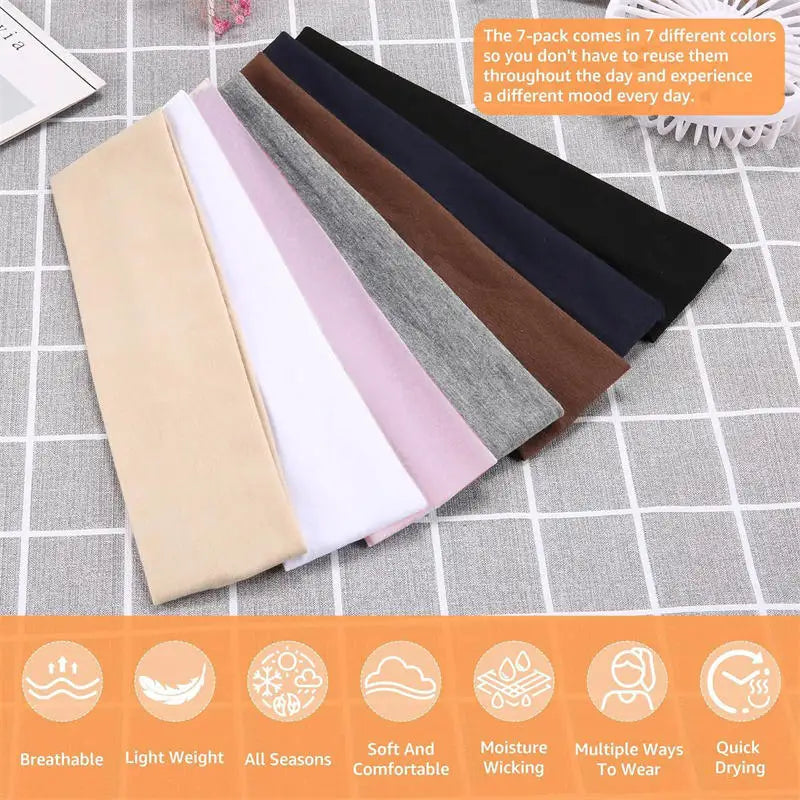 A collection of seven multi-colored stretchy sports headbands laid out on a gray fabric surface.