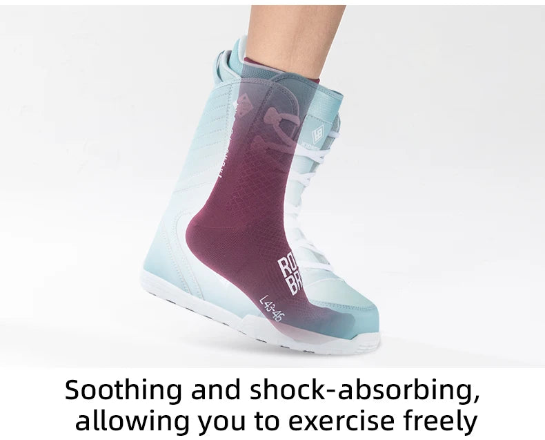 A close-up of a pair of light blue and purple cycling socks being worn on a foot.