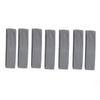 A set of solid gray elastic hair bands arranged in a row.