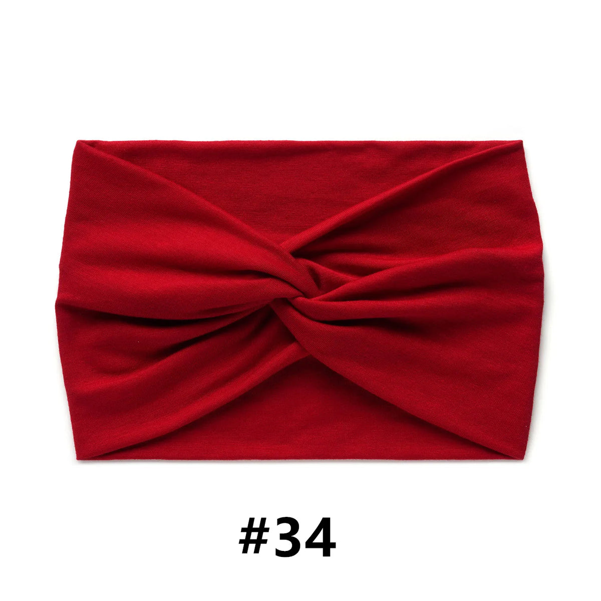 A folded red fabric turban headband