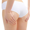 A person applying invisible body shaping patches to their thigh area.