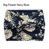 Navy blue fabric headband with a floral pattern, cross-knotted and folded.