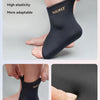 Black elastic fabric knee sleeve with a soft gel layer shown on a foot.