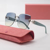 Light luxury frameless sunglasses resting on a pink velvet pouch.