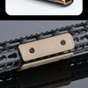 Close-up of a tactical rail panel kit for airsoft guns showing a brass and black rail component.