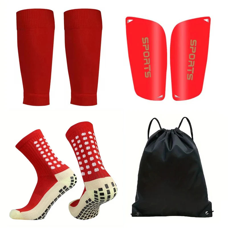 A pack of four red non-slip silicone sports socks and a black sports bag.