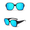 A pair of bright blue polarized sunglasses with black frames shown against a white background.