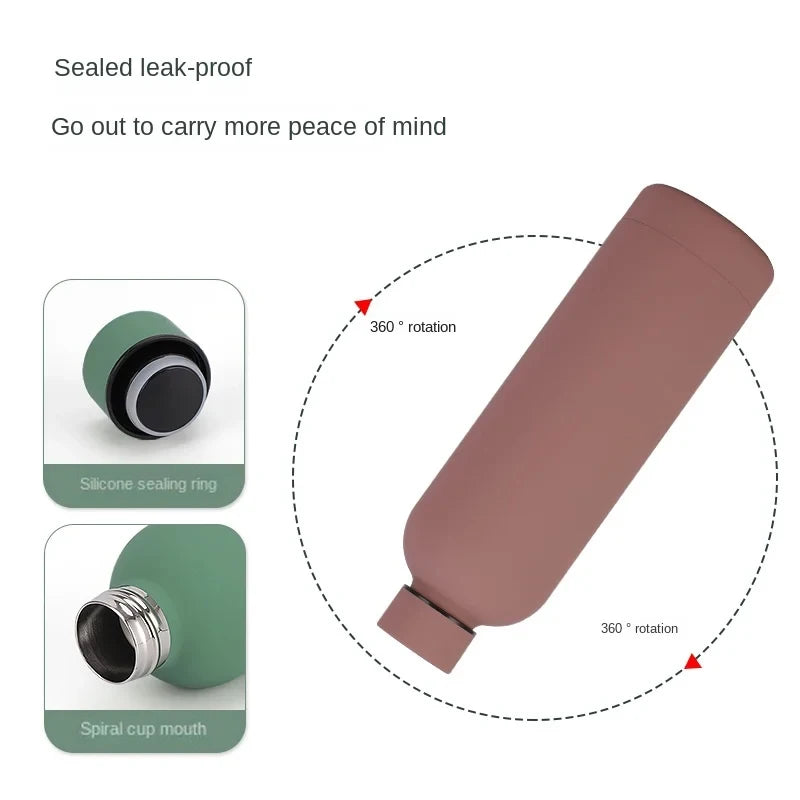 A pink insulated stainless steel thermos cup with a silicone sealing ring and spiral cup mouth.