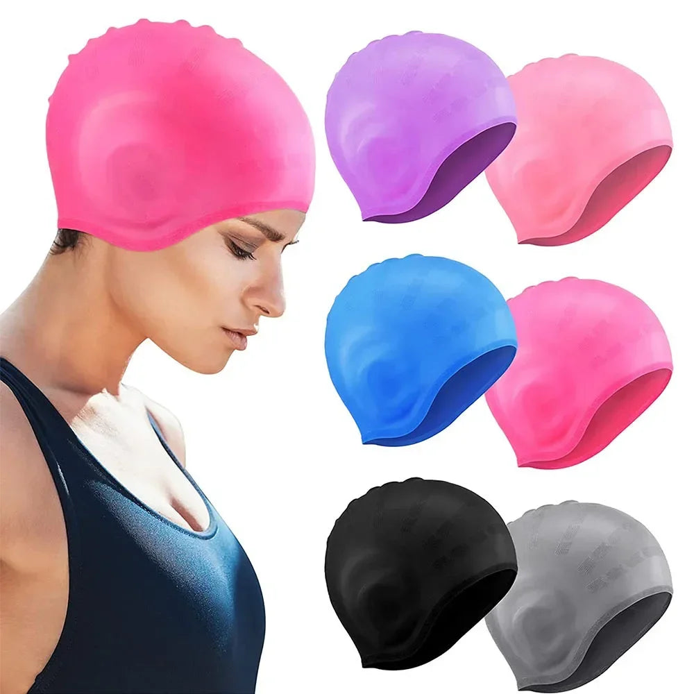 A collection of pink, purple, blue, and black silicone swimming caps shown on a model's head.
