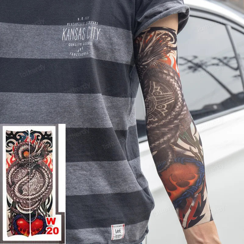 A person wearing a gray t-shirt displays a full sleeve tattoo featuring a dragon design on their arm.