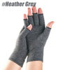 A hand wearing dark grey compression gloves for joint relief.