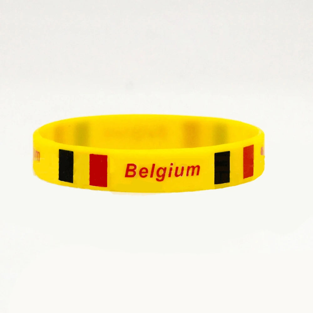 Yellow silicone wristband with black and red stripes and the word Belgium printed on it