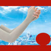 A hand wearing a light gray ice silk arm sleeve against a bright blue sky and icy landscape.