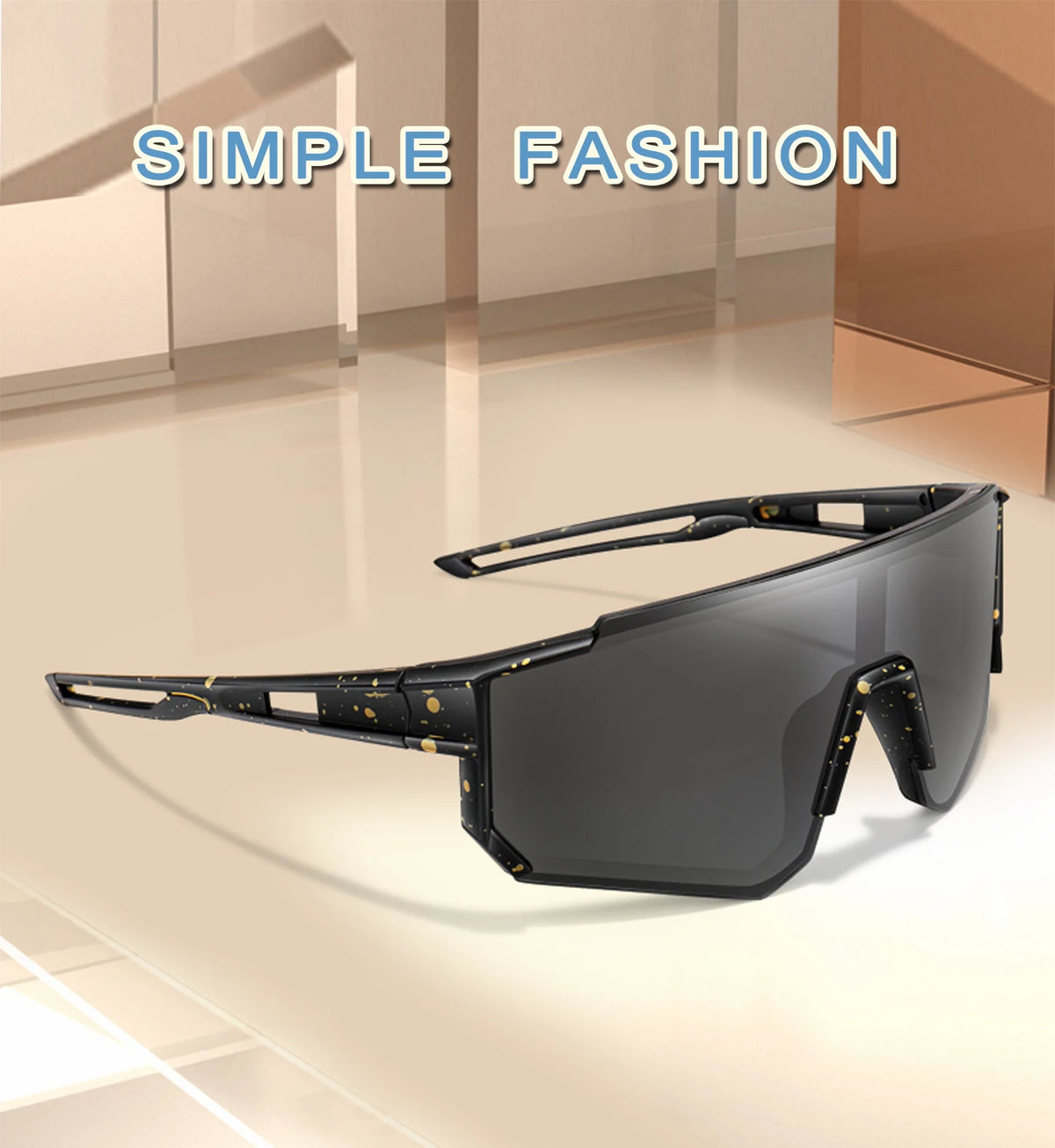 A pair of black sunglasses with a square frame and gold detailing are displayed on a light surface.