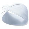 White fabric yoga headband tied in a bow, shown on a wrist.