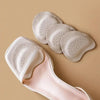 A set of beige anti-slip forefoot pads for high heels, including several individual pads and a shoe sole.