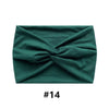 A dark teal fabric headband tied in a bow, shown flat.