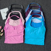 A collection of seamless yoga and pilates sports bras in various colors including black, pink, purple, blue, and gray.