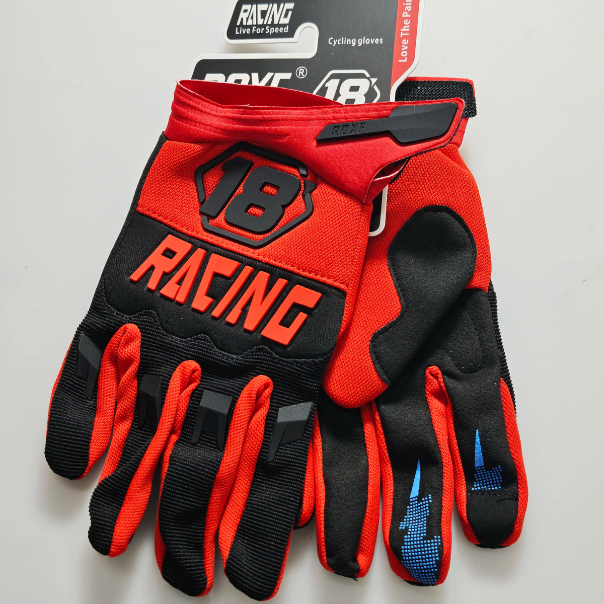 A pair of red and black cycling gloves for riding, shown flat against a white background.