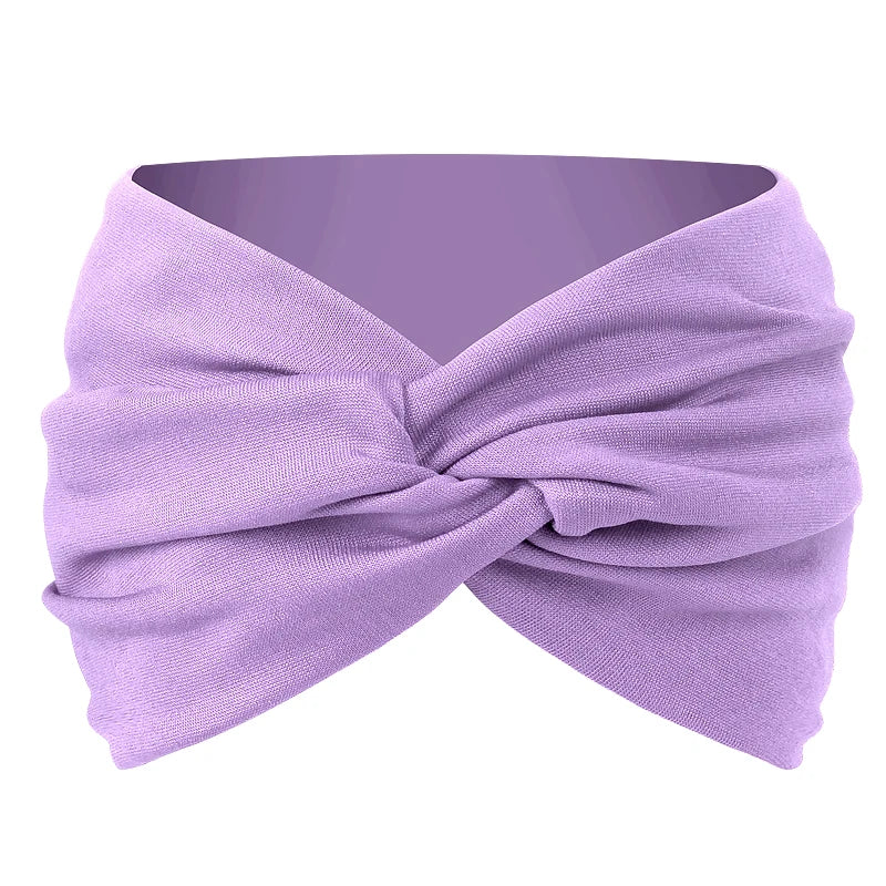 A lavender twisted criss cross elastic headband folded and displayed against a white background.