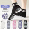 A set of non-slip grip socks in various colors and patterns for yoga and pilates
