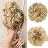 Close-up of blonde hair bun extensions styled in a messy curly updo