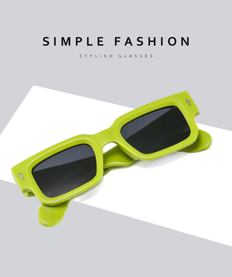 A pair of lime green sunglasses with thick frames and dark lenses resting on a white surface.