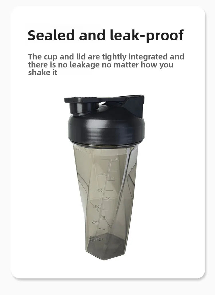 A clear plastic protein shaker bottle with a black sealed cap and measuring lines visible on the side.