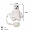A white silicone straw cover shaped like a bear, used for tumblers and water bottles.