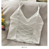 White off-shoulder camisole tank top for women displayed on a light gray surface.