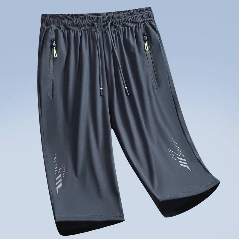 Gray men's quick dry jogging shorts with zippered pockets and a tapered fit