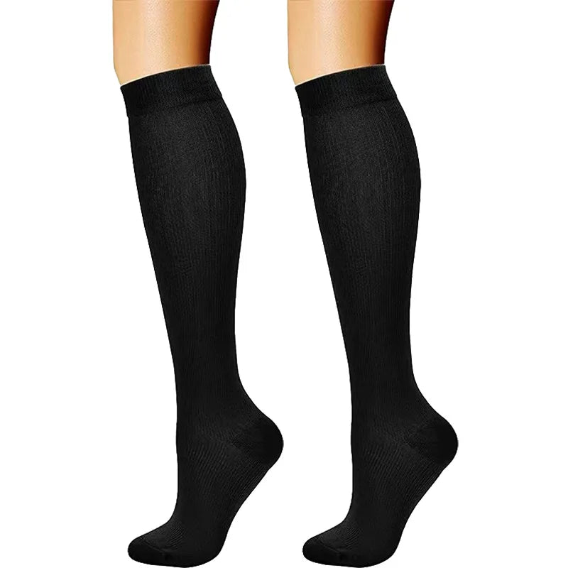 A pair of black compression elastic socks for sports and daily wear.