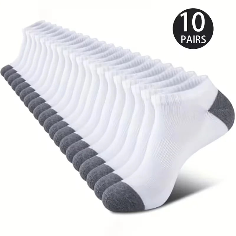 A stack of ten pairs of white and gray comfort fit ankle socks is displayed.