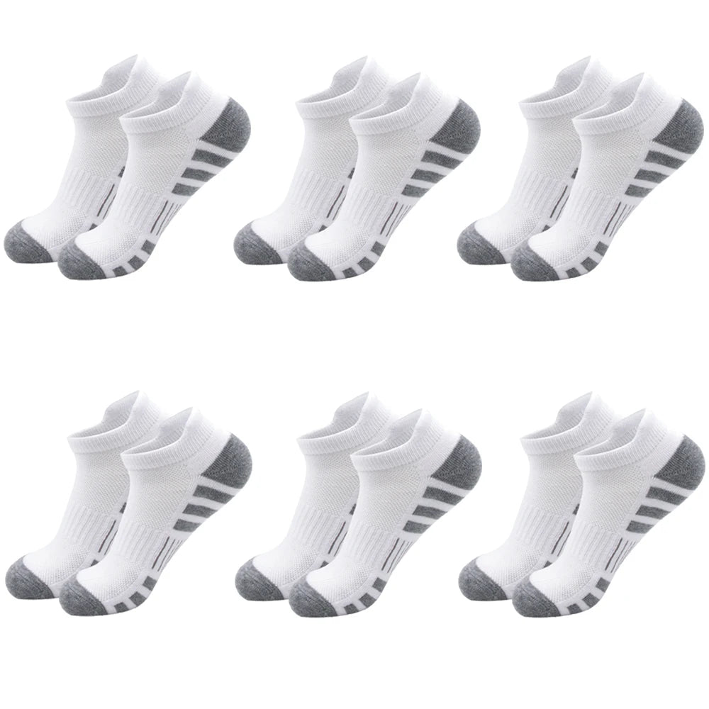 A set of athletic running socks for men and women in white with black stripes.